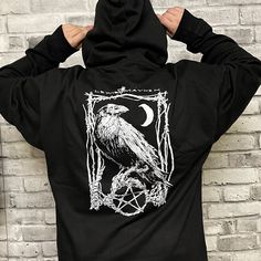 Classic Raven Zip Up Hoody Heavy weight construction to keep you warm and cozy, Soft cotton outer layer with plush, non-shrink polyester inner layers, Full body zipper, Double fleece lined hood with colour match drawstring. Artwork by Comic Book artist/writer Nat Jones Black Gothic Hoodie Sweatshirt, Black Gothic Hooded Sweatshirt, Gothic Hooded Sweatshirt For Streetwear, Black Gothic Hooded Hoodie, Gothic Hooded Halloween Hoodie, Black Gothic Sweatshirt For Halloween, Gothic Hooded Hoodie For Alternative Fashion, Colour Match, Comic Book Artists