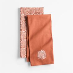 two napkins with pumpkin designs on them