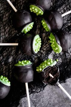 chocolate covered marshmallows and green candies on sticks