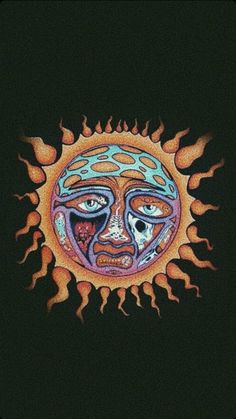 the sun has two faces on it, and is surrounded by orange flames in the dark