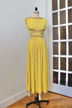 "Amazing 1940s yellow & gold rayon jersey gown with metal zip closure down the side and the most beautifully draped skirt. This dress is in very good vintage condition with a minor spot (pictured) at the bust  B: 32\" W: 25.5\" L: 56\"" 1930s Knit Dress, Vintage Gold Dress, Gold Gown, Bodice Top, Draped Skirt, Rayon Dress, Gold Dress, 50s Fashion, Fashion History