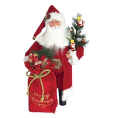 a santa claus figurine holding a small christmas tree and presents in his hand