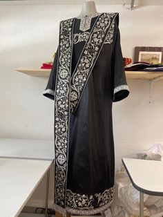 Orthodox deacon vestments set. Fully embroidered, made from silk. It includes stikharion, cuffs and orarion. After the order we will ask your measurements. It takes about four week to produce it and ship to you. We locate in FL, USA. Traditional Black Agbada For Ceremonies, Traditional Black Embroidered Thobe, Black Silk Traditional Wear For Ceremonial Occasions, Ceremonial Black Kurta With Gold Embroidery, Black Kurta With Gold Embroidery For Ceremonial Occasions, Traditional Silk Abaya, Ceremonial Black Kurta With Traditional Patterns, Black Traditional Wear With Embroidered Border For Ceremonial Occasion, Orthodox Priest