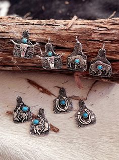 Add a touch of rustic charm to your outfit with our Claiming the Ranch Tag Earrings. These playful dangle earrings feature 4 unique designs, including a cattle tag and paisley texture, all in high polish silver. The 1 1/2" length and fish hook closure make them easy to wear, and the pop of turquoise stone adds a fun twist. Yeehaw! Cattle Tags, Polish Silver, The Ranch, Fish Hook, Turquoise Stone, Rustic Charm, Paisley, Dangle Earrings, Unique Designs