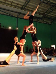 a group of young women standing on top of each other