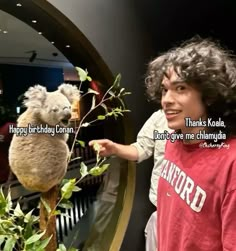 a man is holding a koala up to his face