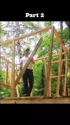 a man standing on top of a wooden structure