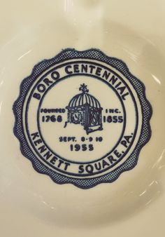 a close up of a plate with a seal on it that says roo centenak