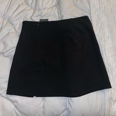 Plain Black Skirt With Small Slit In The Front. Short In Length. Sexy And Cute. Salmon Skirt, Plain Black Skirt, Mini Black Skirt, Button Down Denim Skirt, White Floral Skirt, Tan Skirt, High Waisted Pleated Skirt, Green Mini Skirt, Blue Denim Skirt