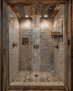 a walk in shower sitting inside of a bathroom next to a wooden wall and ceiling