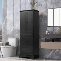 a bathroom with marble walls and flooring, including a black cabinet next to the toilet