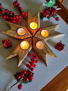 a star shaped candle holder with candles in it