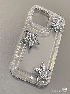 a cell phone case with two snowflakes on the front and back cover in clear