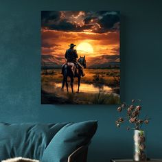 a painting of a cowboy riding his horse at sunset