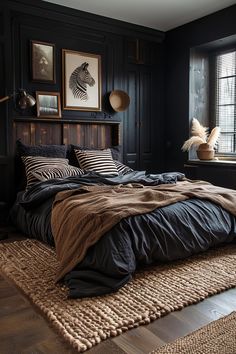 a bedroom with black walls and wooden headboard, zebra print bedding, brown throw pillows