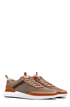 Crafted from full-grain Italian leather and airy mesh, this modern sneaker is a quick way to elevate everyday ensembles. Lace-up style Removable, cushioned insole with arch support Leather, textile and synthetic upper/textile and leather lining/rubber sole Imported Modern Brown Sneakers For Outdoor, Modern Brown Outdoor Sneakers, Modern Brown Sneakers For Sports, Outdoor Leather Sneakers With Perforations, Leather Sneakers With Perforations For Outdoor, Brown Textile Sneakers For Outdoor, Functional Brown Sneakers For Walking, Brown Sporty High-top Sneakers For Walking, Casual Sneakers With Perforations For Outdoor