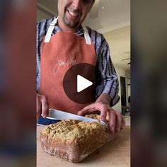 a man in an apron is cutting bread