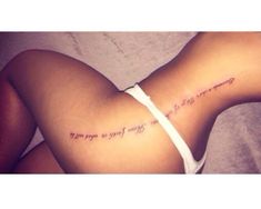 the back of a woman's stomach with words written on it