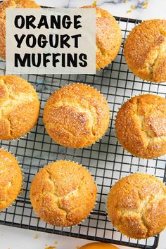 orange yogurt muffins cooling on a wire rack with the words, orange yogurt muffins