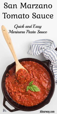 a skillet filled with tomato sauce on top of a table