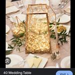 an image of a table setting with flowers and candles on the table for a wedding reception