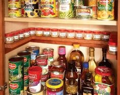 an organized pantry with canned food and condiments