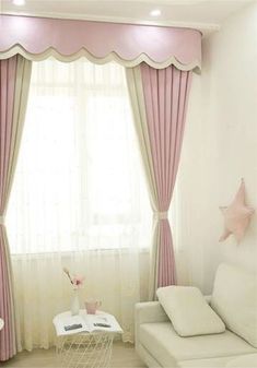 a living room with white furniture and pink curtains on the windowsills, along with a star shaped window sill