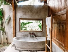 a bathroom with a large bathtub in the middle of it's floor and walls