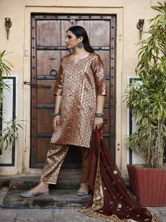 With festivals around the corner, wardrobe update is mandatory. Presenting brocades like never before. Made in straight silhouette with narrow pants and organza dupatta, which is beautified with lovely hand work. Taari and gotta detailing on dupatta is just the right touch. Color: Brown Fabric: Kurta & Bottom- Brocade Dupatta - Organza Note: Length and sizes can be customised Length - Kurta 40 inches Pants 38 inches Available in other colors If you happen to see some deformity in hand-work or fa Festive Banarasi Silk Sets With Resham Embroidery, Festive Traditional Wear With Resham Embroidery In Brocade, Festive Brocade Sharara With Resham Embroidery, Brocade Saree Sets With Resham Embroidery, Festive Anarkali Sets In Brocade, Festive Anarkali Brocade Sets, Festive Brocade Salwar Kameez In Traditional Drape, Banarasi Silk Churidar For Festive Occasions, Transitional Season Bollywood Brocade Salwar Kameez