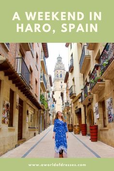 a woman standing in an alley way with text overlay reading a weekend in haro, spain