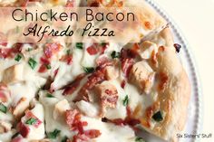 chicken bacon alfredo pizza on a plate with the words chicken bacon alfredo written above it