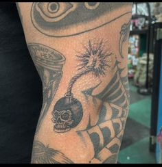 a man's arm with a tattoo on it and a skull in the middle