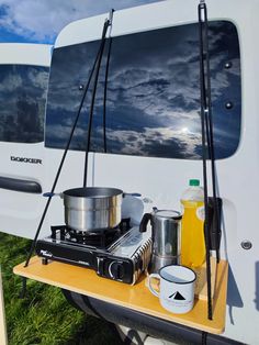 a camper with cooking utensils on the table