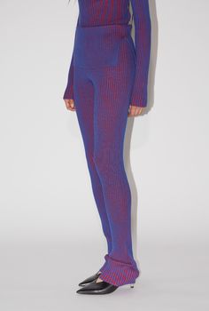 DESCRIPTION Bicoloured knit rib pants with extra long leg, asymmetrical folded waist hem and slit on left side. These pants fit true to size. The model is 173 cm and wearing size XS. MATERIAL 80% viscose, 20% nylon Dancer Fits, Statement Pants, Purple Pants, Black Tank Dress, Black Aviators, Pants Fit, Neon Purple, Fashion Project, 1960s Fashion