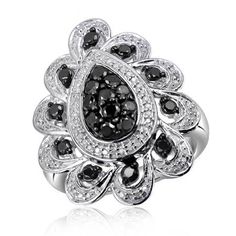 a ring with black and white diamonds on it's side, set in 18k white gold