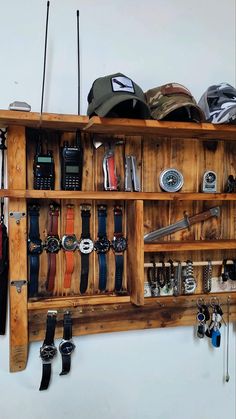 a wooden shelf filled with lots of different types of watches and other things on it