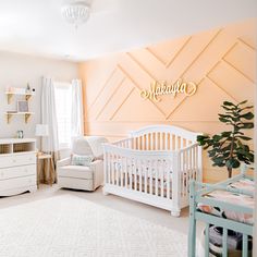 a baby's room is decorated in pastel colors and features white cribs