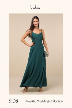 a woman in a long green dress posing for the camera with her hands on her hips