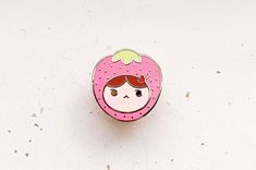 This strawberry girl enamel pin features a kawaii character with a strawberry hat and cute hair clip. Strawberry girl loves the color pink and her favorite time of day is lunch time, she doesn't care much for bananas though. This pin features a cute strawberry girl character and is 1" in size. The pin is set in hard enamel and gold-plated metal. It has a single post on the back.PICK YOUR PIN BACKI ship my pins with custom colored rubber pin backs by default. If you would like a locking (deluxe) Kawaii Pink Enamel Pin Gift, Pink Kawaii Enamel Pin Gift, Cute Pink Pins, Strawberry Hat, Cute Hair Clip, Strawberry Girl, Fancy Rat, Beige Color Palette, Girl Character