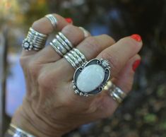 "WHITE BUFFALO RING set in oxidized Sterling Silver.  WHITE BUFFALO STATEMENT RING handcrafted in oxidized Sterling Silver featuring a predominately white colored cabochon.  Signed and dated original statement ring; designed and created for the jewelry collectors and lovers of bohemian chic rings and original wearable art jewelry.   SIZE 8  BAND STYLE: OPEN STYLE - WAVY - four (4) ridge handmade sterling silver band (4RO-W). Band is approximately .3\" wide.   This width is important when conside White Stone Ring, Single Stone Ring, Chic Rings, Wearable Art Jewelry, Handmade Silver Ring, Silver Design, Single Stone, Gemstone Jewelry Handmade, Ring Boho