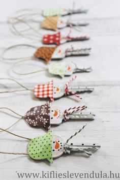 a row of small christmas ornaments hanging from twine