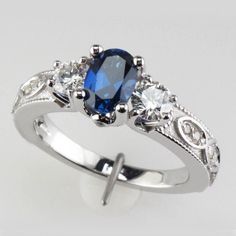 a blue and white ring with diamonds on it