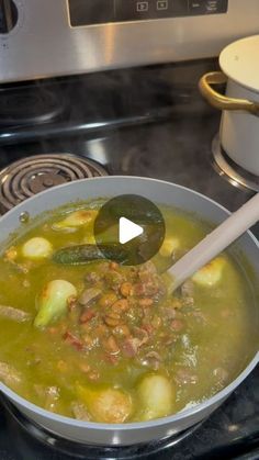 a bowl filled with soup sitting on top of a stove