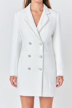 Upgrade your wardrobe with our elegant Pearl Trim Blazer Dress. This sophisticated blazer-style dress is crafted from high-quality tweed fabric, giving it a luxe look and feel. The mini length makes it perfect for any occasion, while the collar and lapel add a touch of chicness. The subtle pearl trim detailing adds a touch of glamour to this classic dress. From formal events to day-time outings, this versatile dress is a must-have. Shop now and elevate your style game with our Pearl Trim Blazer Dress. Tweed Blazer dress Mini length Collar and lapel long sleeves Double breast Pearl button Pearl trim detail at lapel and sleeve Lining Hand wash cold Do not bleach Do not tumble dry Iron low Shell: 100% Polyester Lining: 100% Polyester HN2015D Total length: 33.5" Bust: 34.5" S WHITE: Height 5'9 Classic Structured Blazer Dress For Party, Elegant Tweed Dress With Buttons For Party, Elegant Tailored Mini-length Blazer, Elegant Party Tweed Dress With Buttons, Luxury Fitted Tweed Dress For Formal Events, Elegant Structured Blazer Dress With Buttons, Elegant Single-breasted Mini Blazer Dress, Elegant Mini Length Single Breasted Blazer Dress, Elegant White Blazer Dress For Formal Occasions