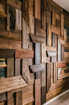 a wall made out of wooden planks in a room