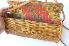 Wicker shoulder and clutch basket bag with leather strap and closure. Inside has a cotton fabric lining. The strap can be inserted inside and you can use as a clutch bag. Wicker bag is excellent choice to coordinate with Hawaiian dress. Condition: New 10.5" W x 5" Tall x 4.5" Wide Rectangular Clutch With Leather Handles For Travel, Rectangular Baguette Bag With Adjustable Strap, Vintage Tote Baguette Bag For Travel, Vintage Baguette Tote Bag For Travel, Rectangular Clutch For Shopping, Gift Shoulder Bag With Top Carry Handle, Rectangular Baguette Bag For Travel, Vintage Baguette Bag With Removable Pouch For Travel, Vintage Baguette Bag With Adjustable Strap For Travel