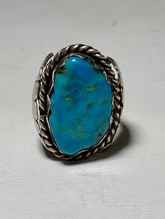 "Turquoise ring Navajo southwest tribal sterling silver women As Is - Wearable as is side of the setting is ever so slightly bent Size 7.75 Weight 11.3g Length 1. 1/8\" Width. 9/16\" Thinnest part of band 1/8\" Delivered in a Gift Box Free Shipping and Free Postal Insurance If you do not want the ring polished and want to leave the natural patina please let me know at the time of purchase as I do polish rings before I ship rings out. Thanks USPS Domestic Shipping is free for buyers. If a buyer p Southwestern Turquoise Rings Stamped 925, Collectible Southwestern Turquoise Ring Stamped 925, Coral Turquoise, Sterling Silver Bands, Turquoise Sterling Silver, Blue Stone, Silver Band, Turquoise Ring, Silver Fashion