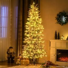 a living room with a lit christmas tree in the corner