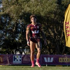 a rugby player is standing on the field