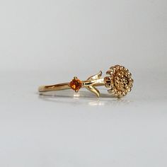 Our special collection of birth flower rings are inspired by the love of wearing something meaningful. Each birth flower is adorned with that month's birthstone. November's birth flower is Chrysanthemum and the birthstone is citrine. Materials: 14K solid gold 2mm natural citrine 1.1mm band thickness ** This item is specially made for you. Please allow 1-2 week lead time. Shipping:Domestic: Free standard shipping within the U.S.International: Free standard shipping for orders over $200 Customizat